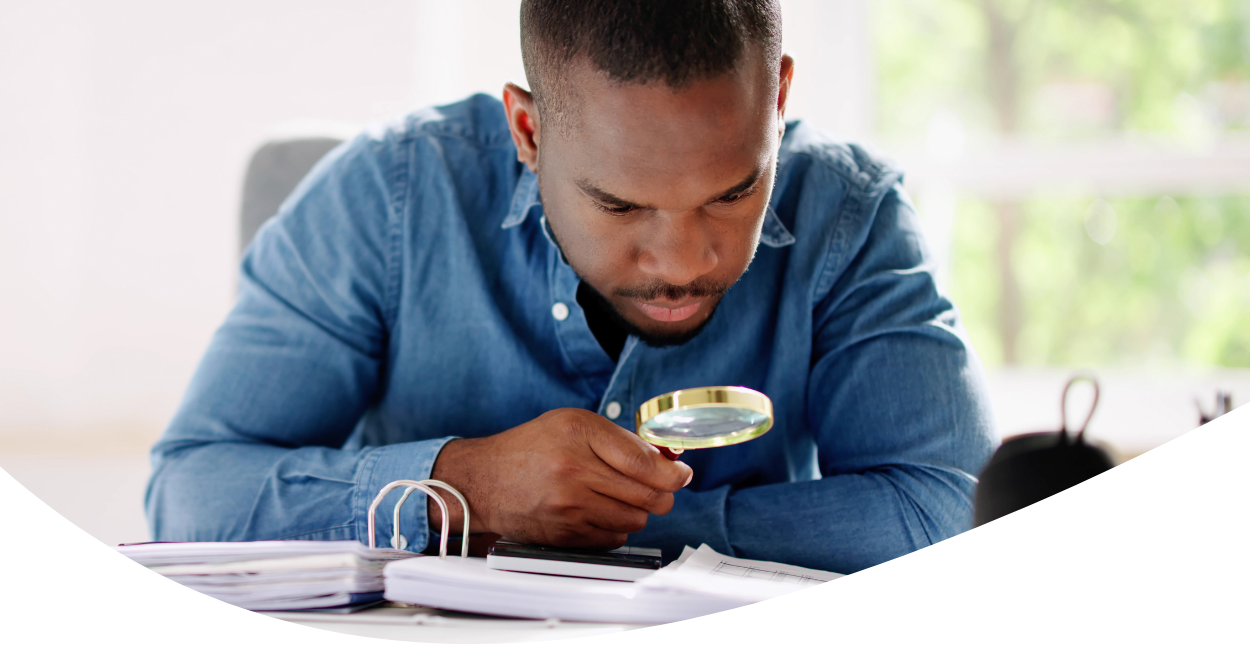 man with magnifying glass