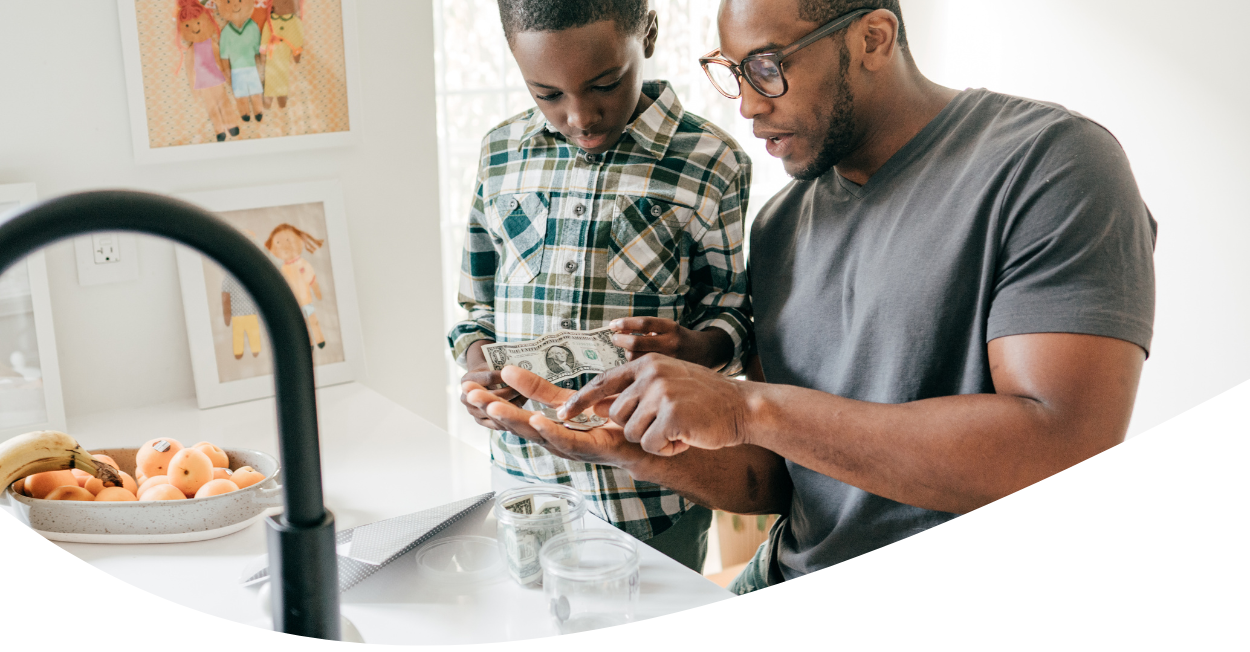 father teaching son about money management